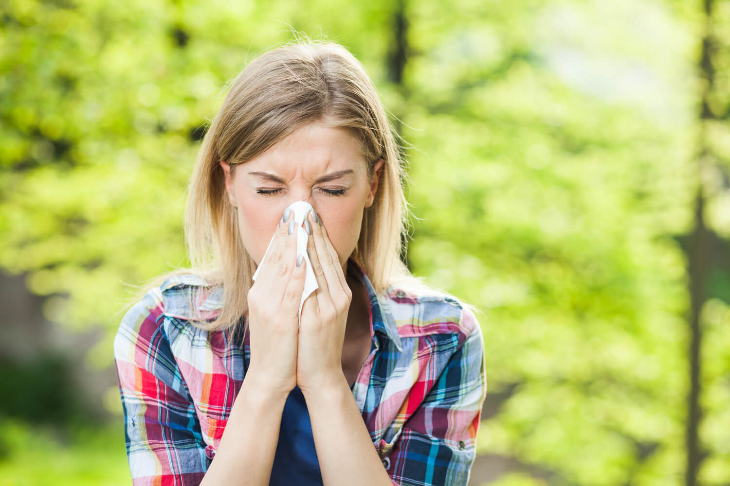 woman-sneezing-field