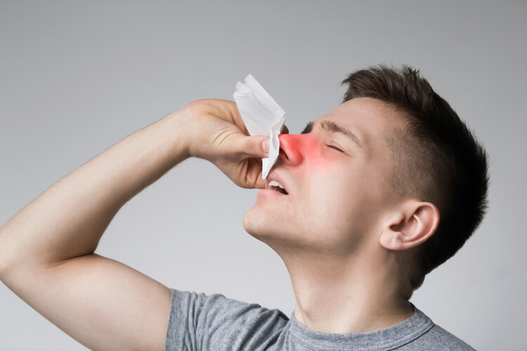 man-holding-nose